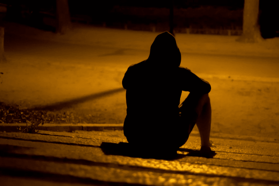  Lonely Man Sitting in a Dark Park