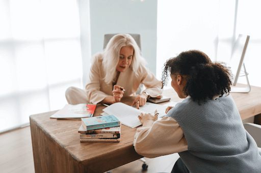 Teacher discussing her lesson with her student