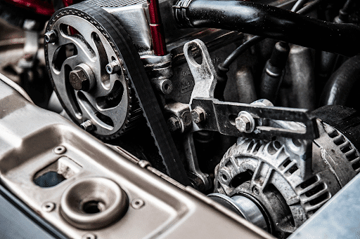 Close-up photo of a black and silver car engine