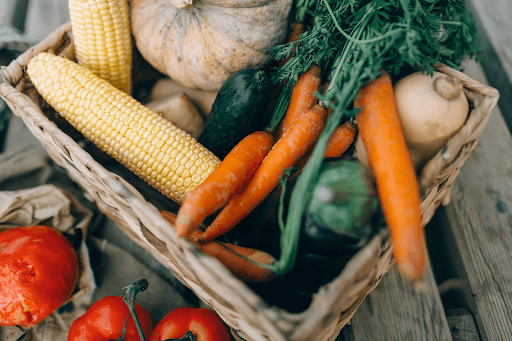 Assorted vegetables on a brown woven basket