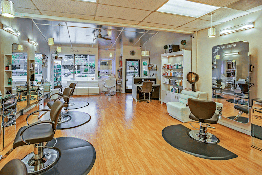  white and black chairs inside a salon (beauty bar image)
