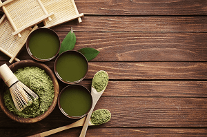 green tea set in a wooden table