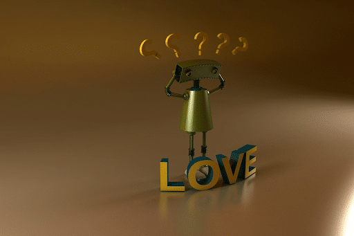 A small robot with his hands on his head standing near a LOVE sign