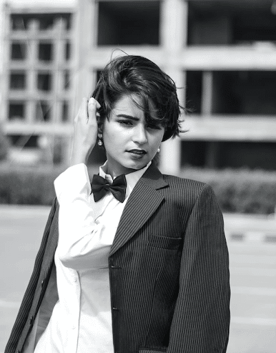 a short hair woman with a suit