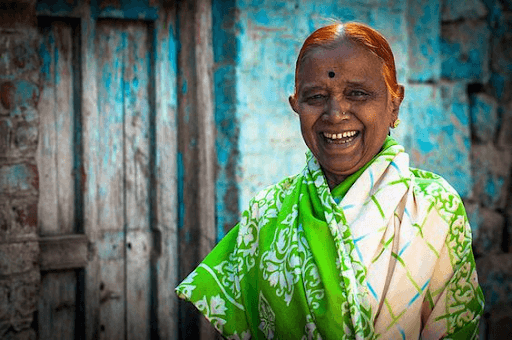  Laughing elderly Indian woman on her traditional dress