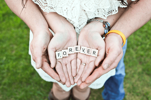  A couple holding forever scrabble letters