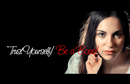  An executive businesswoman and a “Trust Yourself! Be a Boss!” writing