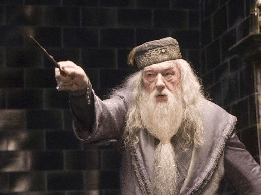 Upset Dumbledore pointing his wand onto something