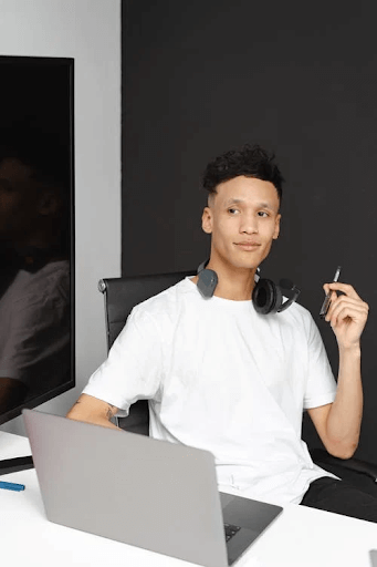 Man in White Shirt Working in a Call Center