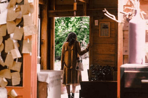 Woman Standing Near Open Door About to Get Out