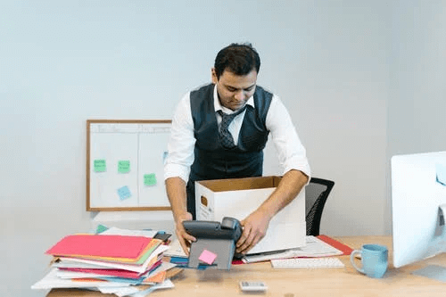 Man Packing His Desk