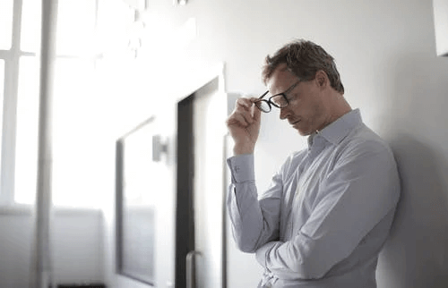 Photo of Man Holding Black Glasses